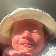 Noah is registered to the contest to win money with this photo: baby, infant, hat, sleeping, hand, face, skin, clothing, sunlight, closeup, portrait, newborn, peaceful, soft, cute, child, resting, indoors, headwear, expression