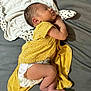 baby, newborn, sleeping, diaper, yellow_clothing, polka_dots, infant, cute, peaceful, resting, child, soft_fabric, lying_down, skin, head, foot, hand, indoors, person, toddler