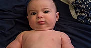 Tate joined the competition — help win amazing prizes! arm, baby, bare_chest, blanket, child, curious, cute, diaper, expression, face, head, indoor, infant, lying_down, person, pillow, resting, skin, small, young