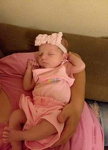 Layla is registered to the contest to win money with this photo: baby, birth, bonnet, cheek, child, fashion_accessory, finger, hair_accessory, hand, headband, headgear, headpiece, person, pink, product, skin, textile, thumb, toddler