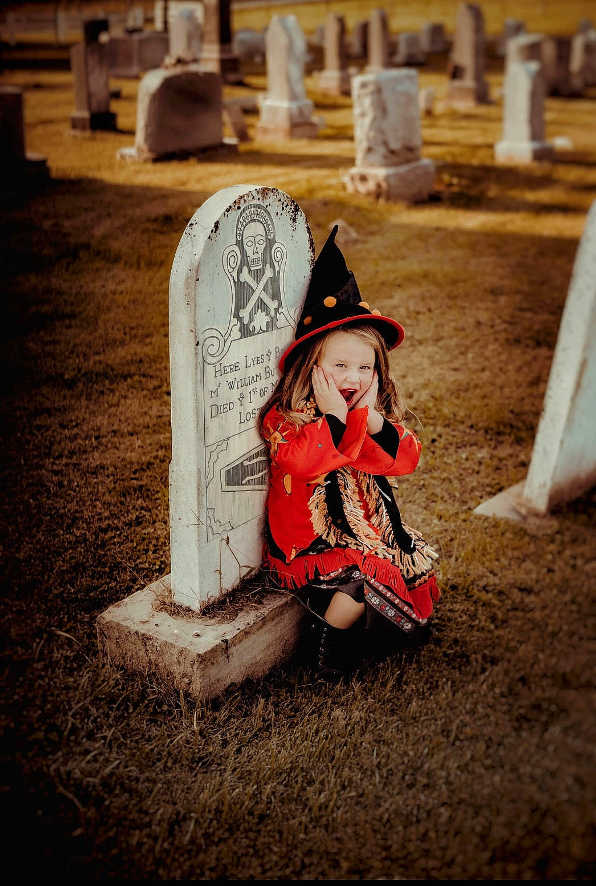 Kenlee joined the competition — help win amazing prizes! beauty, cemetery, child, fashion_accessory, flash_photography, fun, grass, grave, happy, hat, landscape, lighting, person, photograph, shadow, sitting, stock_photography, sun_hat, tints_and_shades, toddler