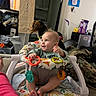 baby, child, infant, smiling, sitting, activity_walker, toys, colorful, indoor, home, dog, pet, blanket, laundry, furniture, portrait, playtime, happy, baby_clothing, household