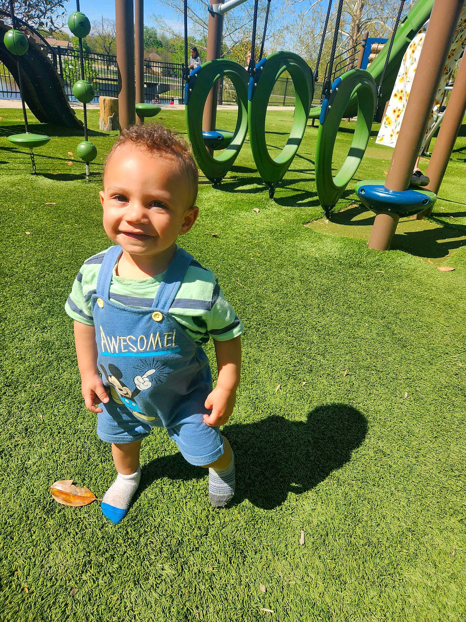 Octavius is registered to the contest to win money with this photo: baby, baby_toddler_clothing, child, fun, grass, grass_family, grassland, green, happy, joy, lawn, leg, leisure, people_in_nature, person, plant, playground, public_space, recreation, sky
