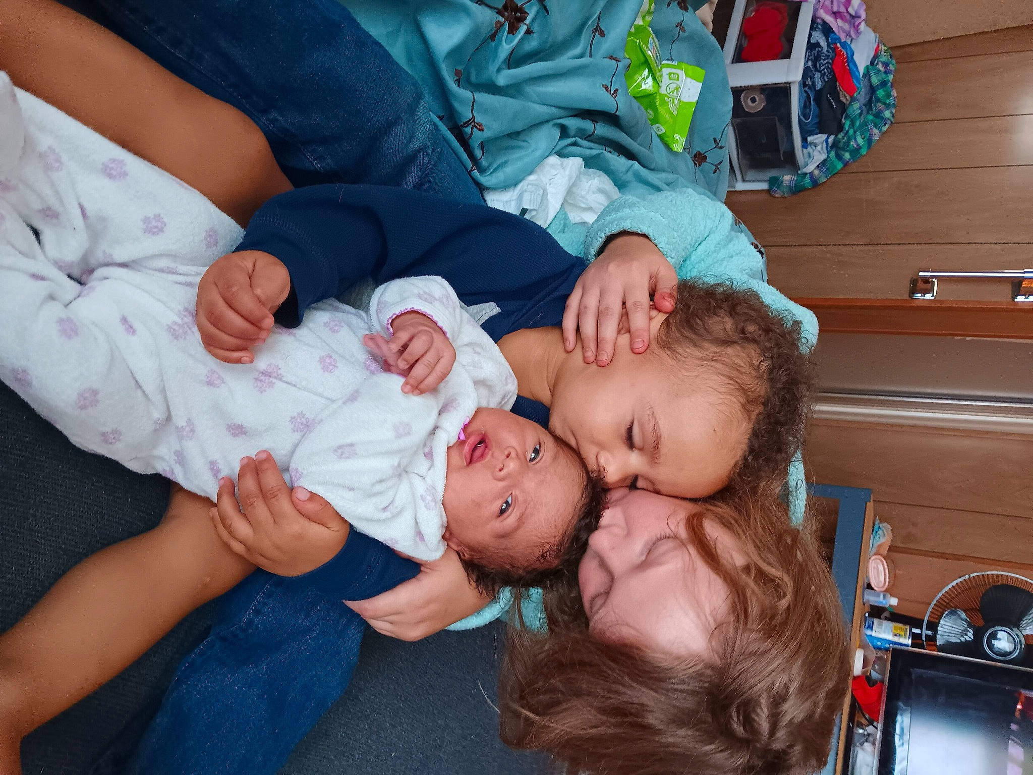 Khaleesi is registered to the contest to win money with this photo: arm, baby, baby_toddler_clothing, child, comfort, elbow, event, finger, foot, fun, gesture, happy, head, interaction, leg, person, sitting, smile, thigh, toddler