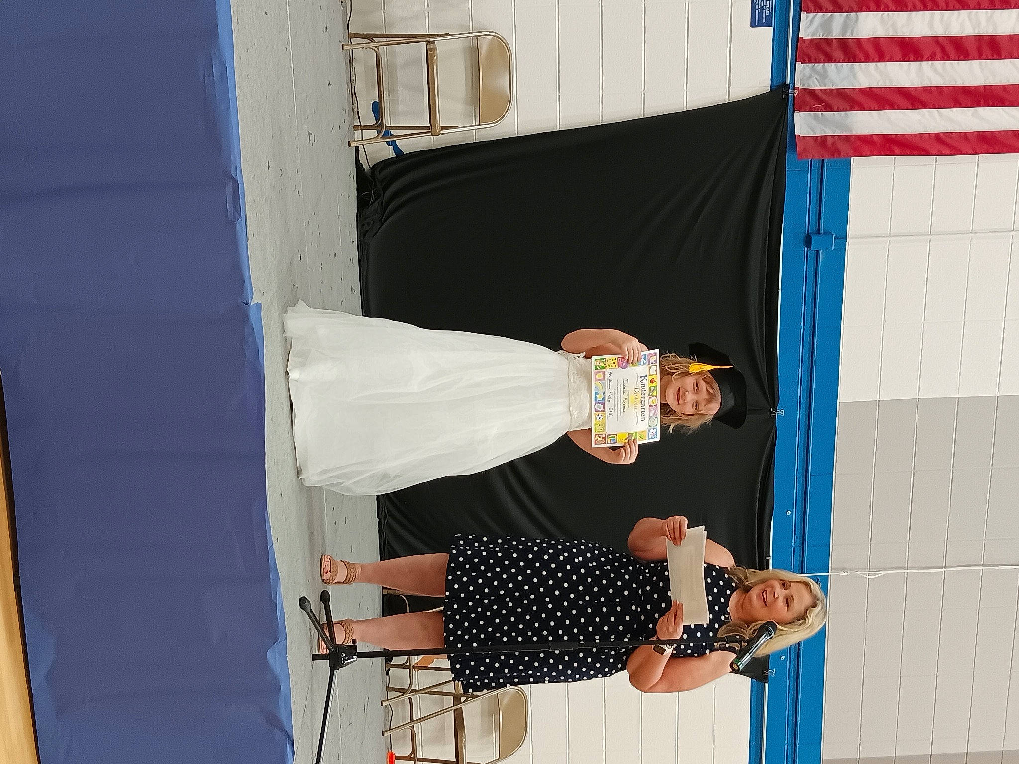 Isabella is registered to the contest to win money with this photo: event, fashion_design, flag, headwear, human_leg, joy, knee, pattern, person, room, thigh, wrist