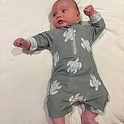 Grayson joined the competition — help win amazing prizes! baby, infant, lying_down, grey_outfit, turtle_pattern, bed, white_sheet, arms_stretched, legs_bent, looking_away, cute, indoors, child, newborn, soft_lighting, skin, head, feet, sleepwear, resting