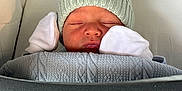 Grayson joined the competition — help win amazing prizes! newborn, baby, sleeping, knit_hat, mittens, blanket, cozy, infant, closeup, portrait, cushion, fabric, soft, peaceful, wrapped, resting, cute, indoors, child, warm