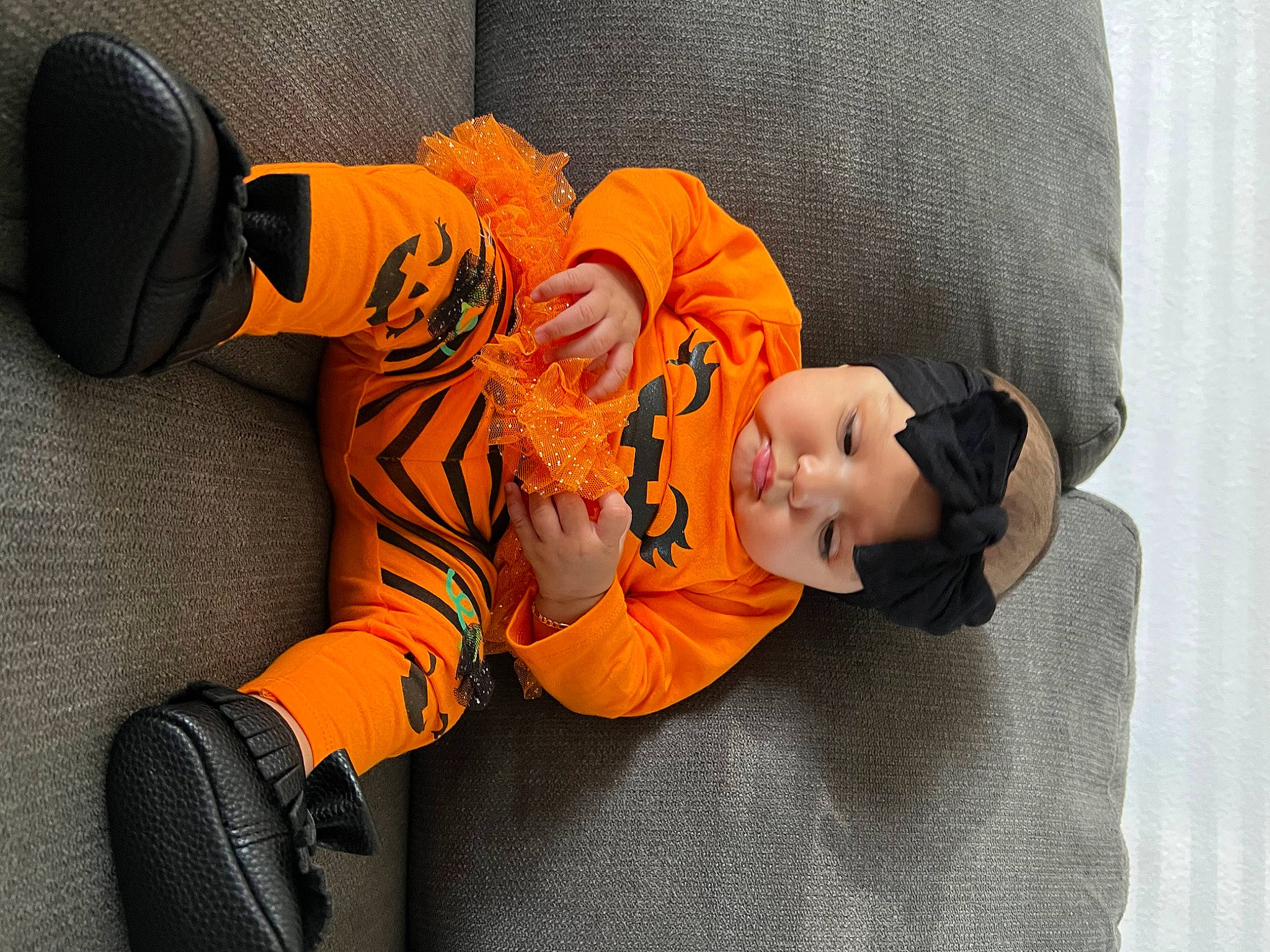 Raquel joined the competition — help win amazing prizes! baby, baby_products, baby_sleeping, baby_toddler_clothing, baby_toys, beanie, child, comfort, flooring, fun, glove, headgear, orange, person, personal_protective_equipment, room, sitting, sock, stuffed_toy, toddler