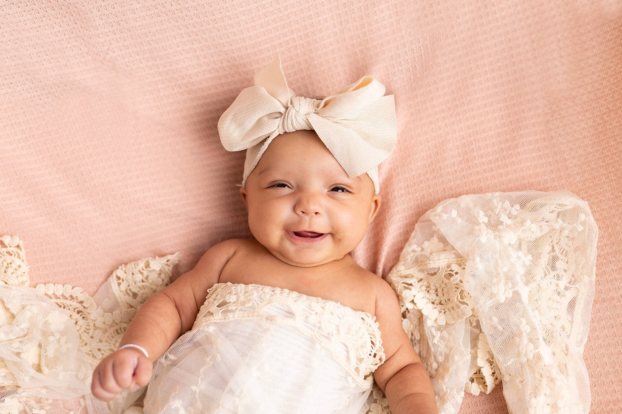 Raquel is registered to the contest to win money with this photo: baby, baby_toddler_clothing, bridal_accessory, bridal_clothing, child, embellishment, event, fashion_accessory, flash_photography, gown, happy, headband, headpiece, headwear, jewellery, joy, peach, person, smile, toddler
