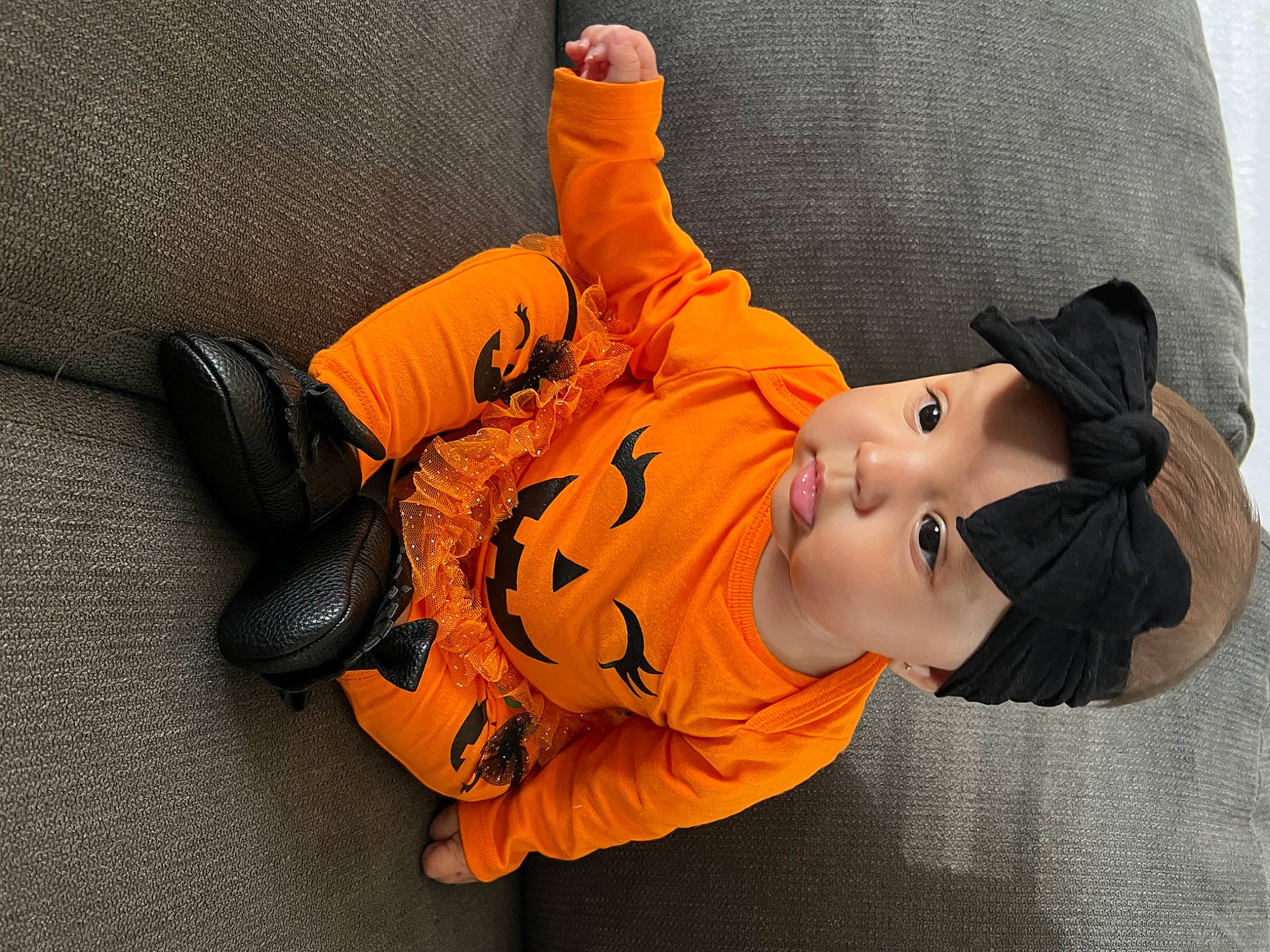 Raquel joined the competition — help win amazing prizes! cap, child, comfort, costume_hat, glove, hat, orange, person, personal_protective_equipment, plant, sitting, sun_hat, toddler