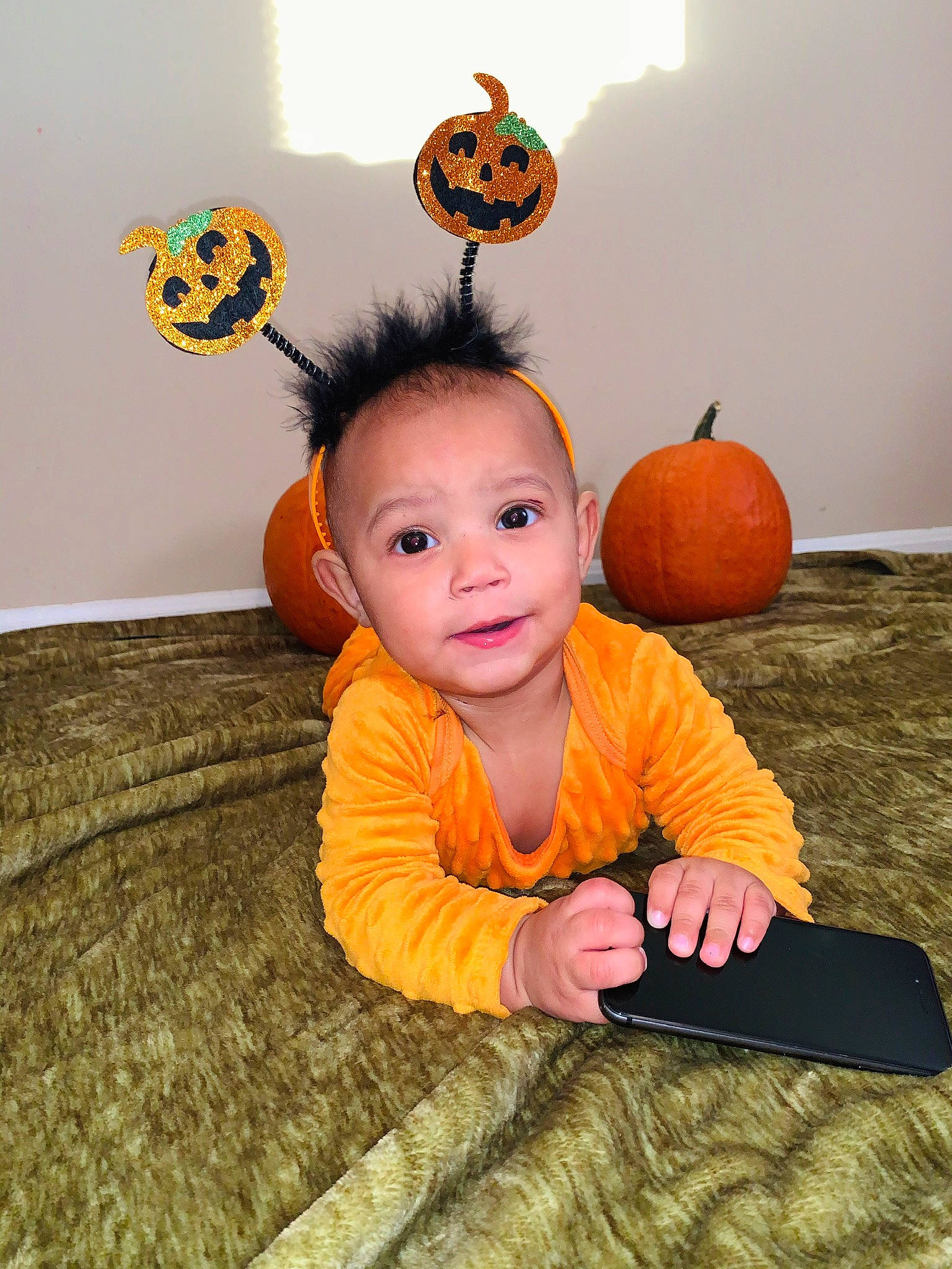 Xavier joined the competition — help win amazing prizes! baby, baby_toddler_clothing, calabaza, child, costume, face, happy, head, orange, person, pumpkin, room, sitting, skin, toddler, yellow