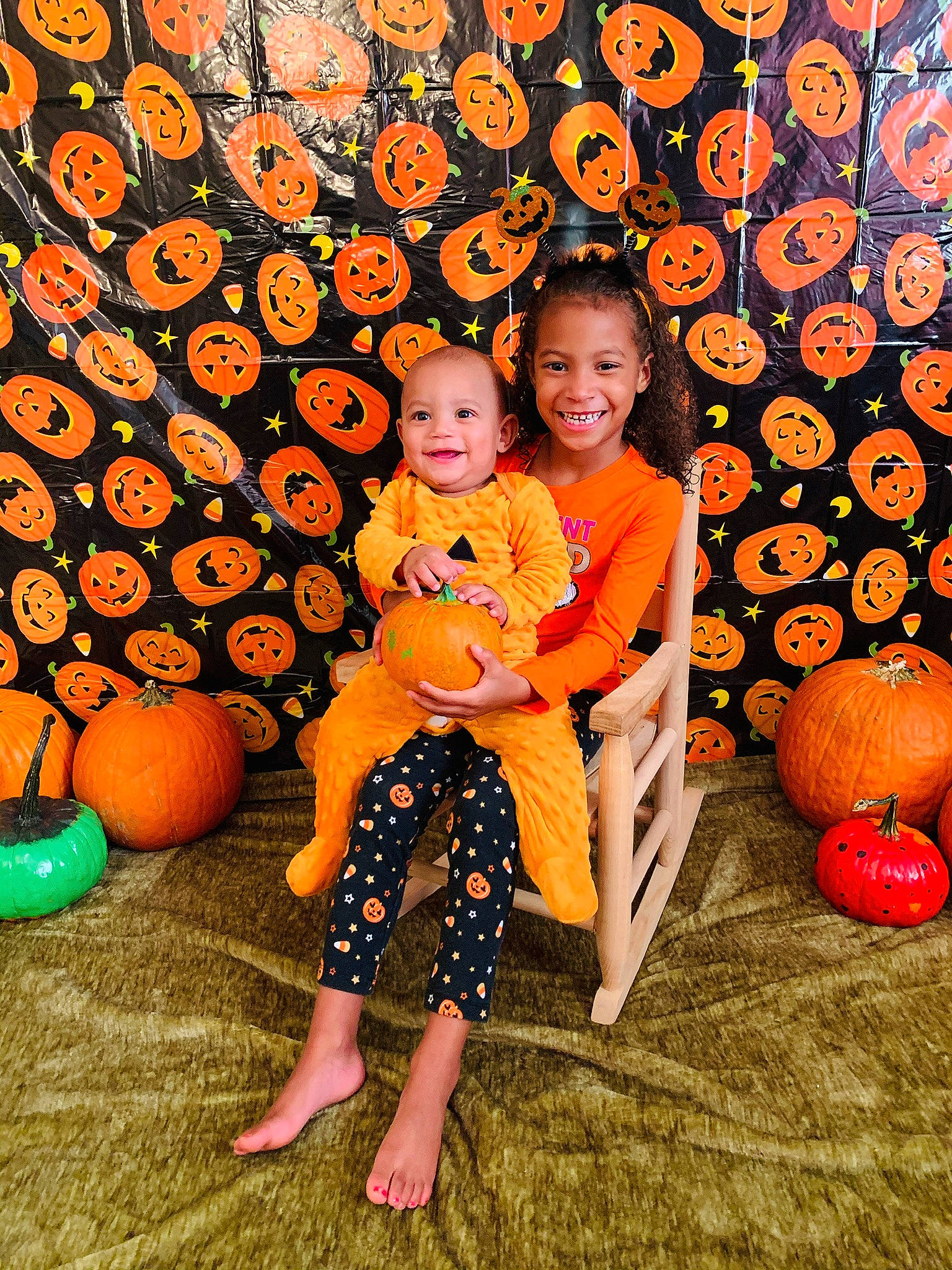 Xavier is registered to the contest to win money with this photo: autumn, calabaza, child, family, fruit, fun, joy, orange, people, person, plant, pumpkin, toddler, vacation