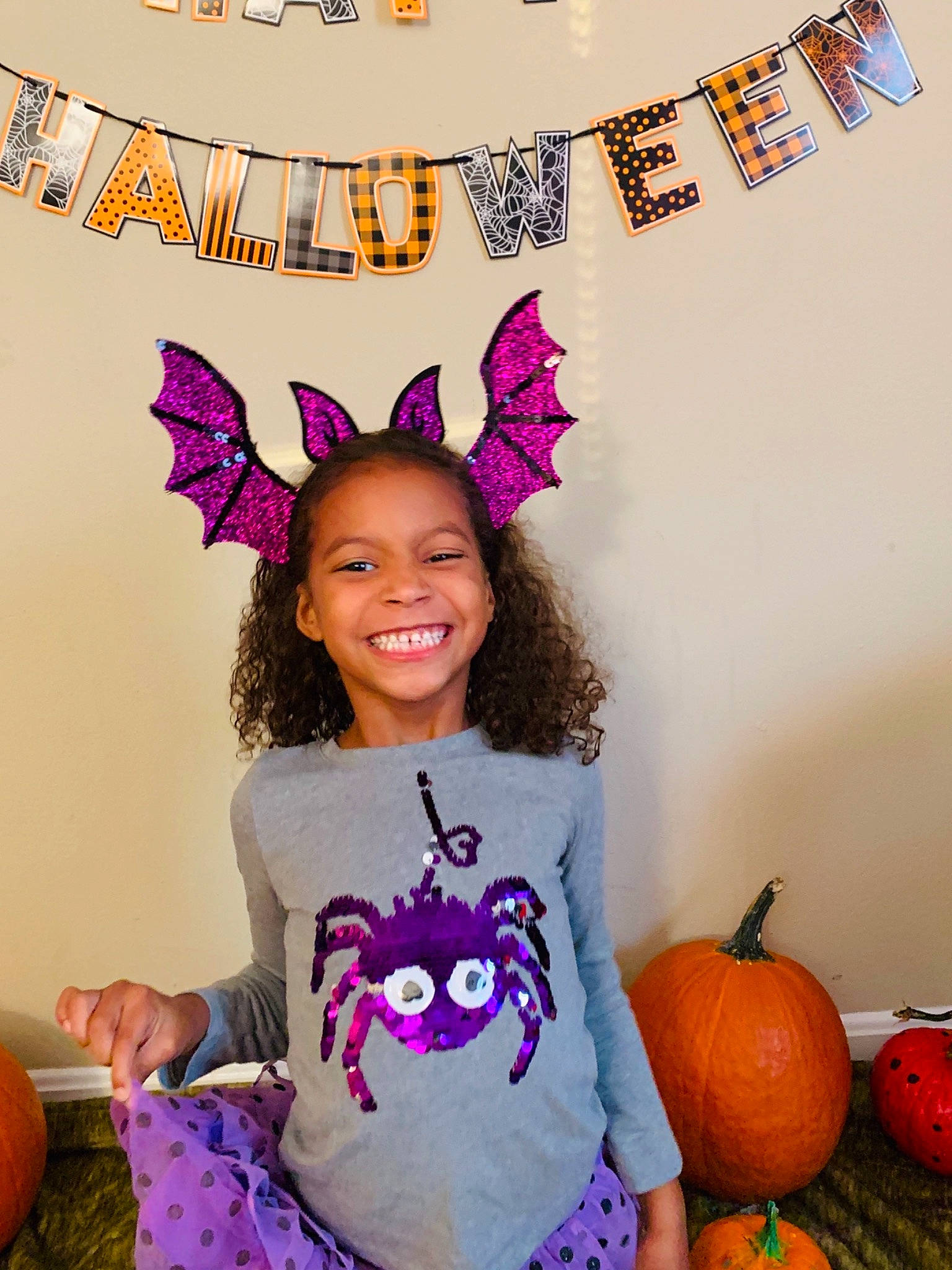 Addy joined the competition — help win amazing prizes! calabaza, candy_corn, child, costume, costume_accessory, ear, head, headgear, joy, owl, party, party_hat, party_supply, person, pumpkin, purple, smile, toddler, tooth, trick_or_treat