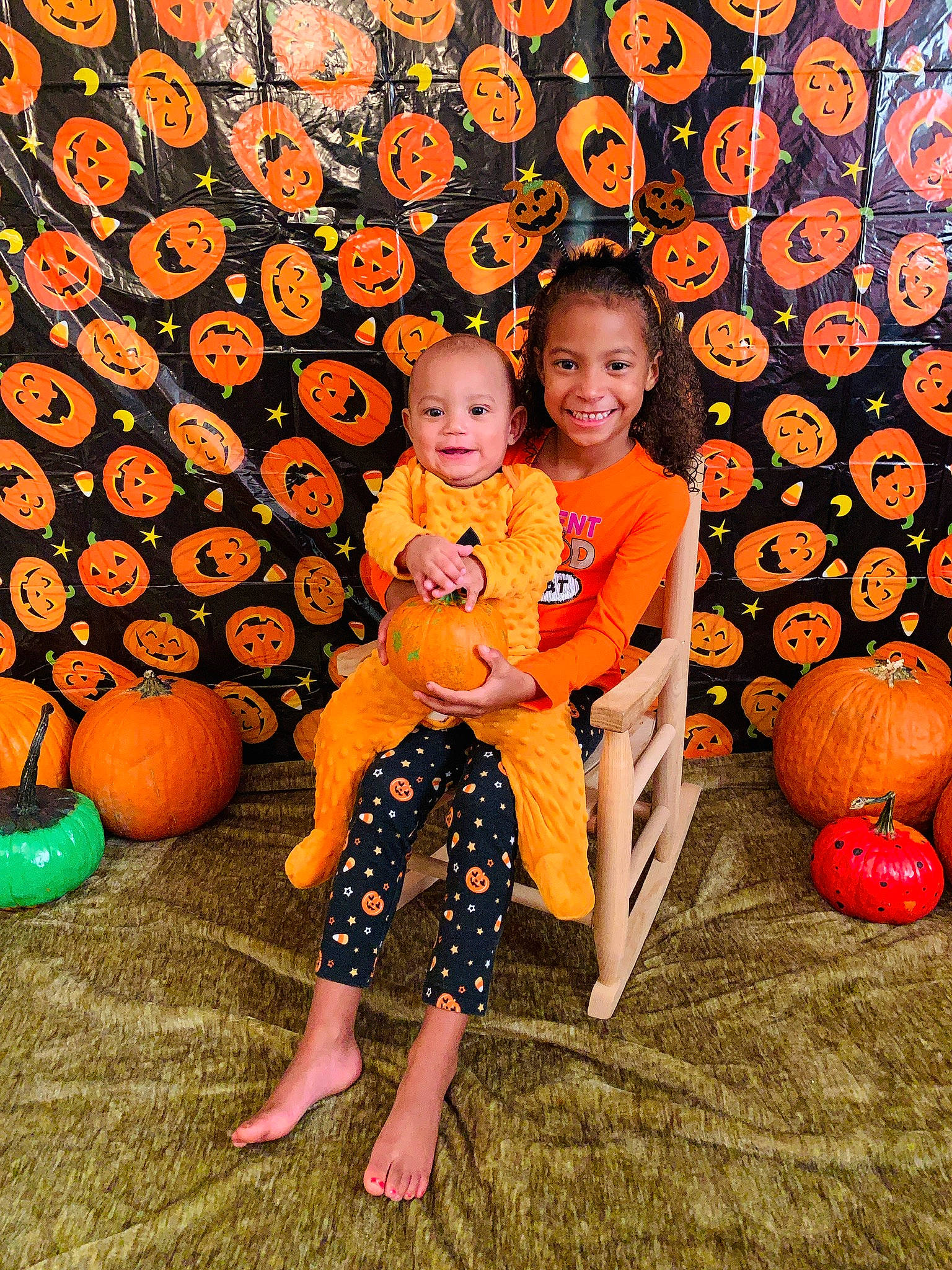 Addy is registered to the contest to win money with this photo: calabaza, child, cucurbita, family, fruit, fun, joy, orange, person, plant, pumpkin, toddler, winter_squash