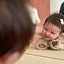 baby, smile, reflection, mirror, infant, cute, hair_clip, mat, indoors, child, happy, face, portrait, skin, clothing, hands, young, closeup, playful, warm