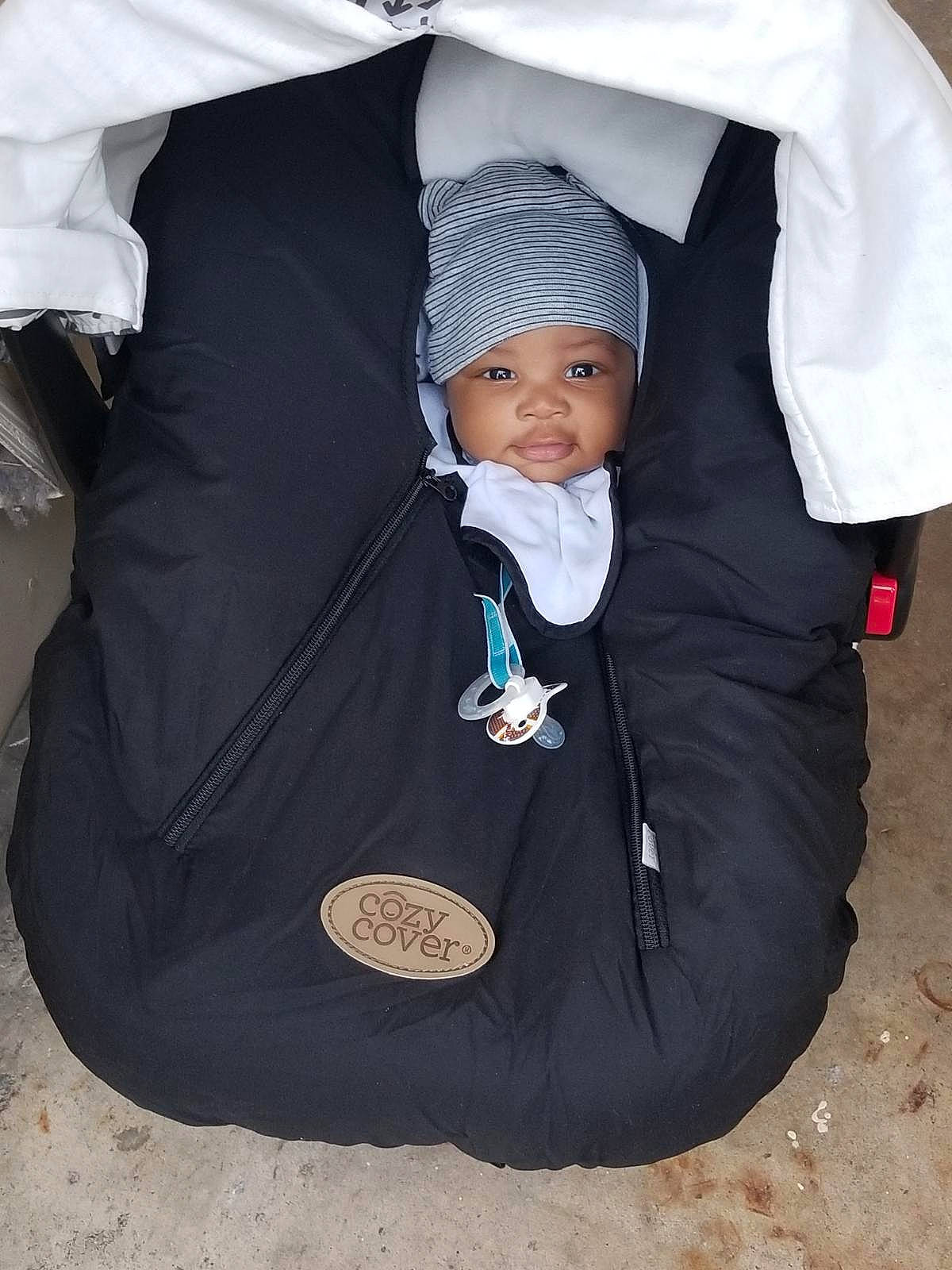 Jayse is registered to the contest to win money with this photo: baby_carriage, baby_products, car_seat, child, fun, girl, outerwear, person, product, toddler