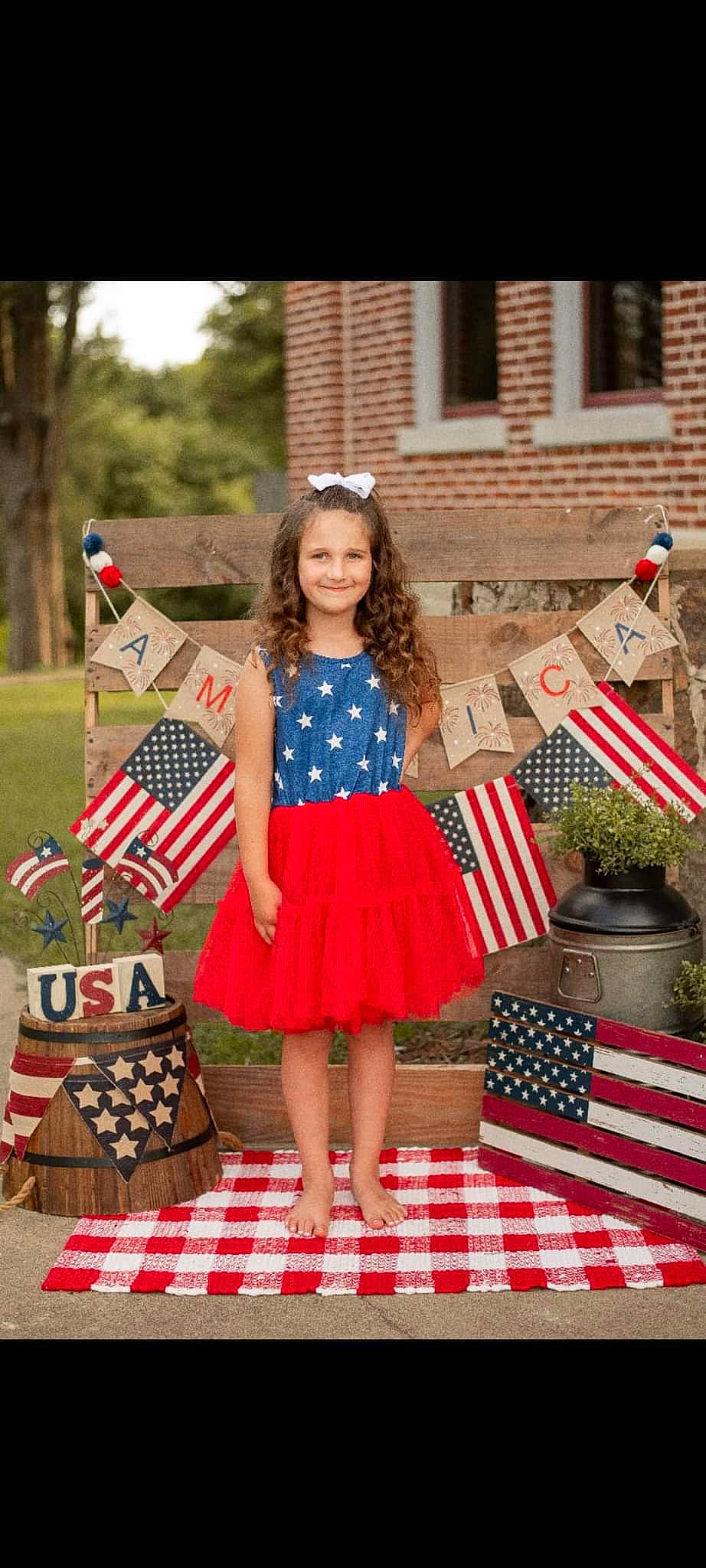 Averie is registered to the contest to win money with this photo: child, day_dress, dress, electric_blue, event, fashion, flag, flag_day_usa, flag_of_the_united_states, grass, holiday, joy, pattern, person, pink, plaid, plant, recreation, red, smile