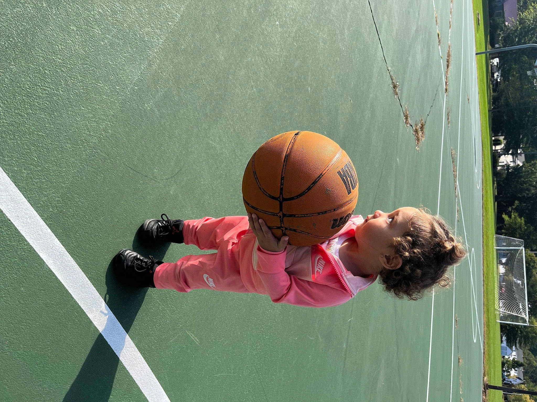 Zailee is registered to the contest to win money with this photo: arm, ball, ball_game, basketball, competition_event, football, grass, helmet, leisure, net, person, player, playing_sports, recreation, sports, sports_equipment, sports_gear, sports_toy, streetball, team_sport