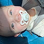 Rippley joined the competition — help win amazing prizes! baby, pacifier, car_seat, child, infant, blue, seatbelt, sunlight, face, closeup, cute, young_child, resting, safety, child_seat, indoors, skin, clothing, head, peaceful