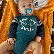 Rippley joined the competition — help win amazing prizes! baby, pacifier, blanket, orange, onesie, blue, navy, text, smile, infant, cute, face, child, clothing, diaper, hand, leg, bunny_ears, toddler, portrait