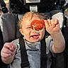 Rippley is registered to the contest to win money with this photo: baby, child, pacifier, stroller, smiling, happy, infant, cute, seatbelt, clothing, outdoor, sunlight, portrait, hand, face, hair, teeth, baby_toys, seat, baby_wear