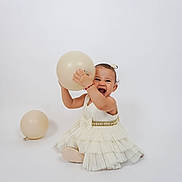 Aleah Calderon joined the competition — help win amazing prizes! toddler, child, balloon, white_dress, happy, smiling, sitting, playful, studio, photography, cute, small_child, innocence, joy, celebration, festive, background, isolated, girl, dress