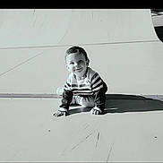 Tiliano participe au concours pour gagner de l'argent avec cette photo : baby, clothing, crawling, face, footwear, grass, head, nature, outdoorplayarea, outdoors, pants, person, photography, plant, playarea, portrait, shoe, sitting, slide, toy