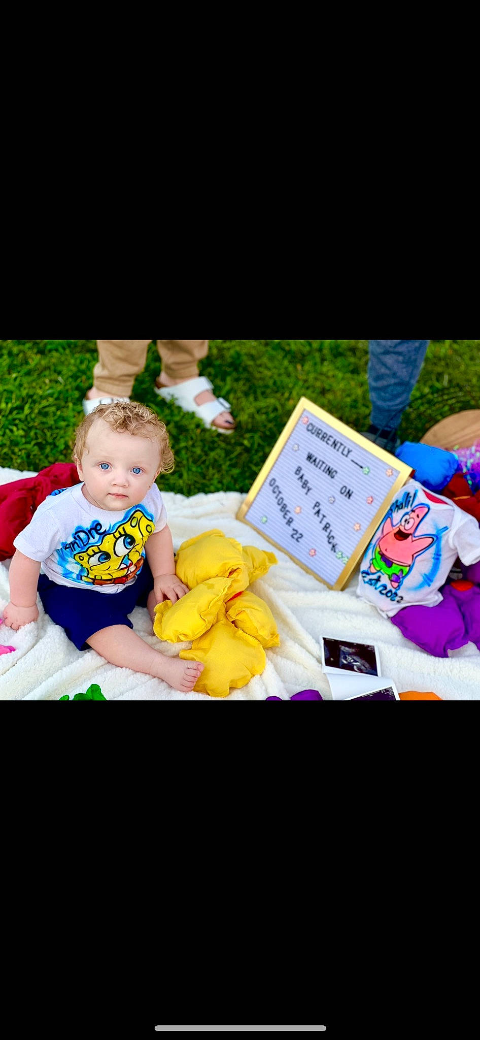 Andre is registered to the contest to win money with this photo: baby, baby_toddler_clothing, child, event, font, fun, grass, happy, leisure, people_in_nature, person, photo_caption, picnic, plant, play, portrait_photography, recreation, sharing, sitting, toddler