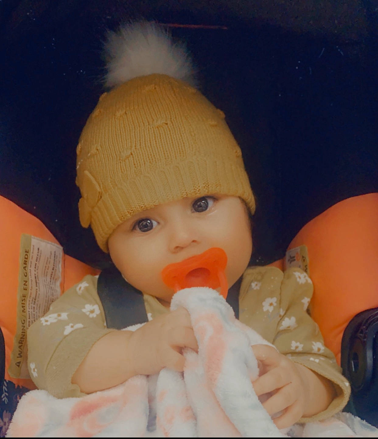 Alexandra is registered to the contest to win money with this photo: baby, baby_products, baby_sleeping, baby_toddler_clothing, beanie, cap, cheek, child, comfort, facial_expression, fun, knit_cap, lip, mouth, nail, nose, orange, person, skin, thumb
