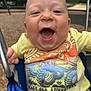 Kevin joined the competition — help win amazing prizes! baby, child, swing, playground, smiling, happy, sitting, clothing, yellow_shirt, outdoor, metal, blue, face, hand, play, joy, infant, expression, closeup, fun
