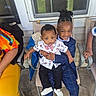 Montrell joined the competition — help win amazing prizes! child, children, smiling, porch, chair, suit, bow_tie, baby, holding, happy, people, outdoor, window, footwear, casual, family, clothing, fabric, seat, toddler