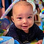 Soan participe au concours pour gagner de l'argent avec cette photo : baby, smile, face, child, toy, play_mat, indoor, hands, cute, infant, colorful, clothing, expression, person, closeup, happy, young, skin, head, looking
