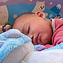 Soan participe au concours pour gagner de l'argent avec cette photo : baby, sleeping, plush_toy, soft_toy, cuddling, child, indoor, cozy, cute, cartoon_background, colorful, comfort, peaceful, face, head, clothing, red_stripes, infant, resting, nursery