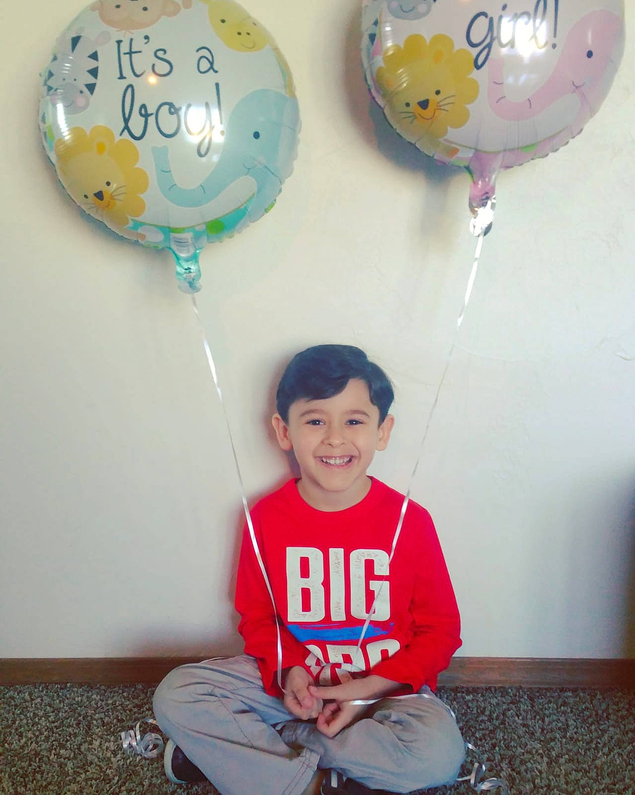 Paulo joined the competition — help win amazing prizes! baby_toddler_clothing, balloon, circle, cool, dishware, facial_expression, inflatable, joy, lap, party, party_supply, person, sitting