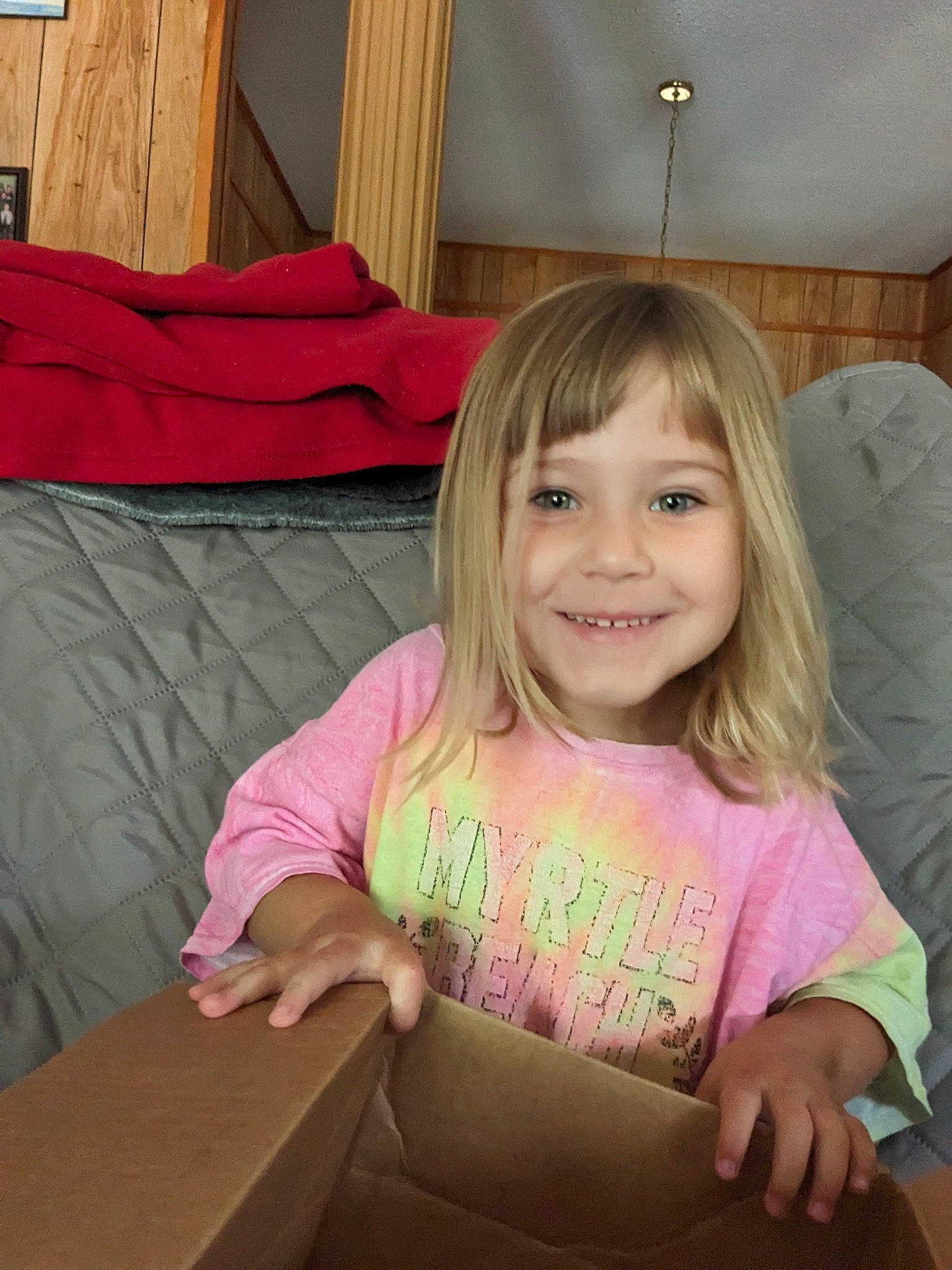 Madison is registered to the contest to win money with this photo: beauty, blond, child, comfort, couch, fun, grass, hairstyle, happy, head, iris, joy, leisure, person, pink, room, skin, smile, summer, t_shirt