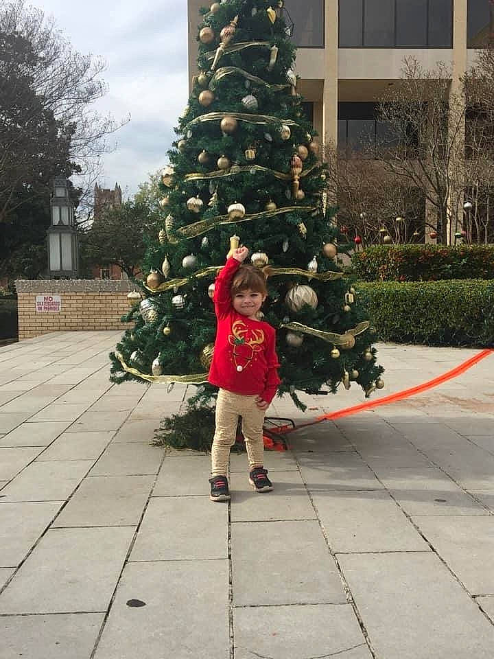 Samantha is registered to the contest to win money with this photo: architecture, christmas, christmas_decoration, christmas_ornament, christmas_tree, colorado_spruce, conifer, event, evergreen, fir, fun, holiday, interior_design, joy, person, pine_family, plant, spruce, standing, tree