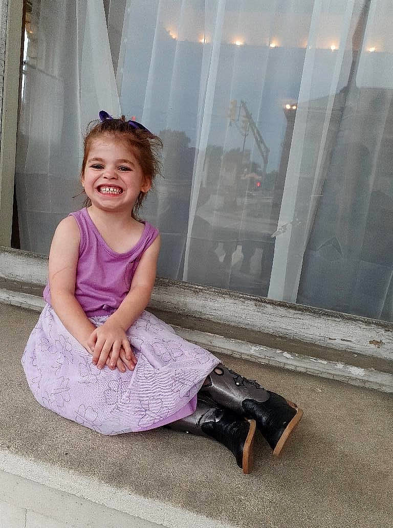 Samantha joined the competition — help win amazing prizes! child, child_model, dress, floor, flooring, footwear, joy, leg, person, photography, pink, purple, shoe, sitting, smile, toddler, vacation