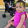 Kmayrah joined the competition — help win amazing prizes! toddler, baby, stroller, outdoor, child, concrete, pavilion, sunlight, headband, flower, pink_clothing, curly_hair, footwear, sitting, expression, daylight, shade, baby_clothing, relaxing, park
