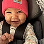 Chloe is registered to the contest to win money with this photo: apparel, baby, beanie, blanket, car_seat, carhartt, child, closeup, cozy, cute, face, floral_clothing, hand, happy, indoor, infant, pink, portrait, seatbelt, smiling