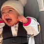 Chloe is registered to the contest to win money with this photo: baby, baby_clothes, car_seat, child, closeup, cozy, cute, fuzzy_hat, happy, hat, indoor, infant, person, pom_pom, portrait, seatbelt, small_hands, smiling, straps, white_clothing