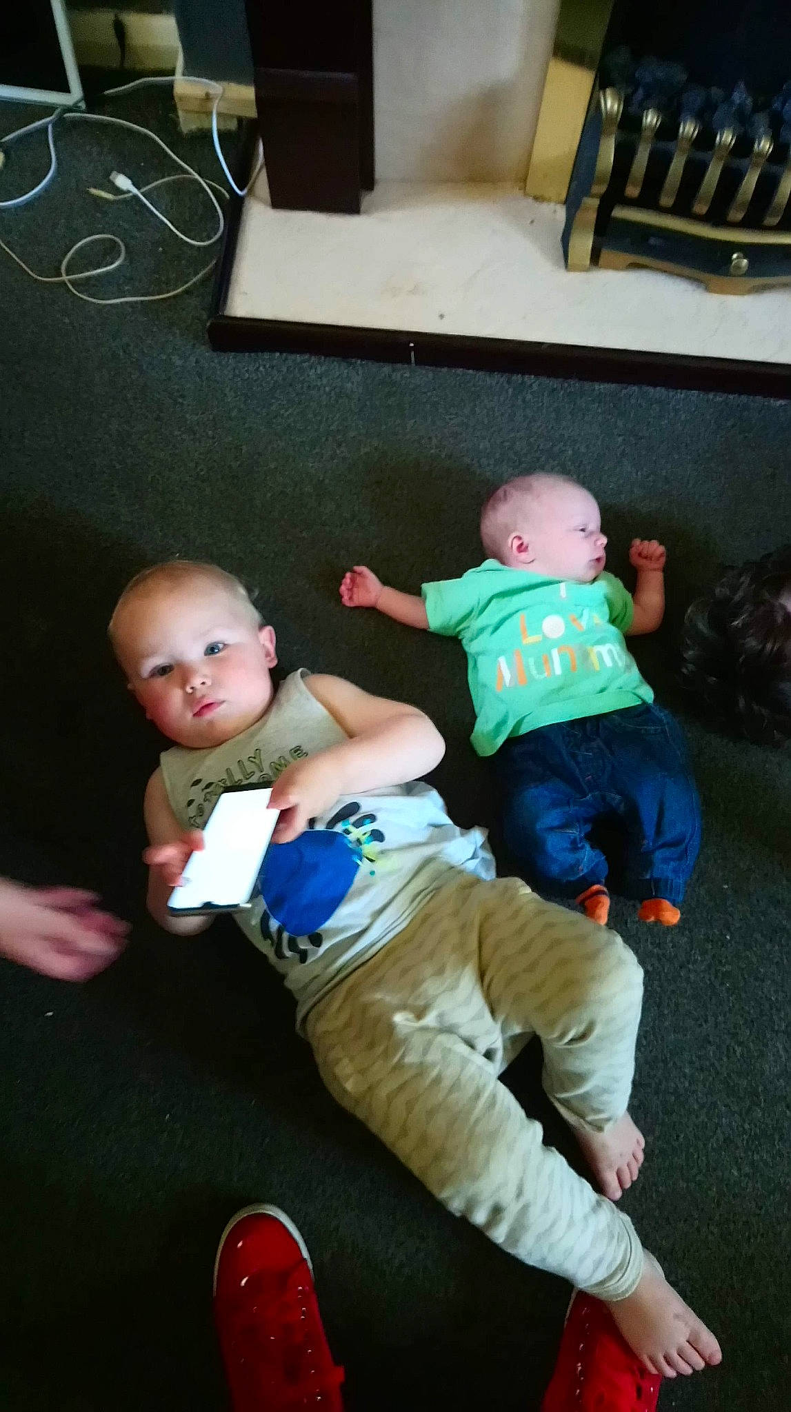 Giorgio Armani is registered to the contest to win money with this photo: arm, baby, child, leg, person, play, sitting, toddler