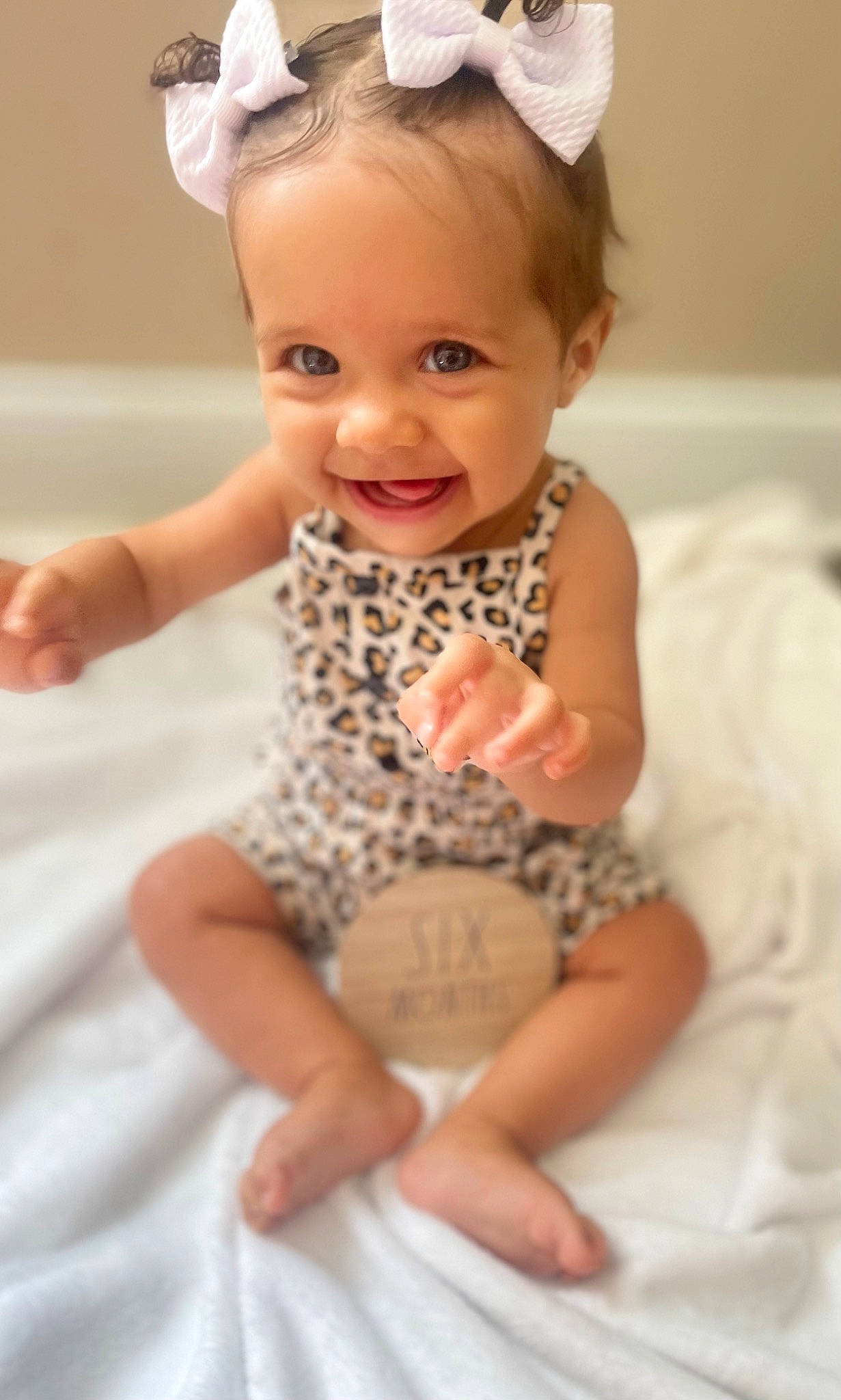 Kalyssa joined the competition — help win amazing prizes! baby_toddler_clothing, cheek, dress, eye, face, finger, gesture, hairstyle, happy, head, human_body, iris, joy, neck, person, pink, skin, sleeve, smile, standing