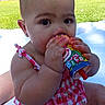 baby, child, outdoor, grass, blanket, food, drink, messy, pink_clothing, checkered, chubby_cheeks, cute, summer, sunlight, hands, face, person, sitting, eating, cup