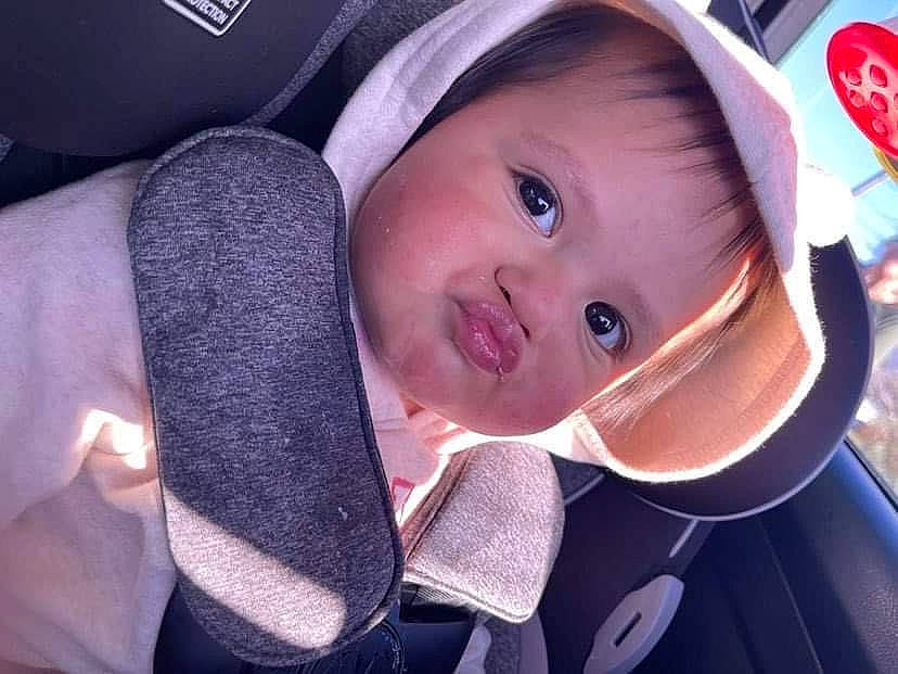 Brianna is registered to the contest to win money with this photo: auto_part, baby, baby_carriage, baby_products, car_seat, car_seat_cover, cheek, comfort, electric_blue, fashion_accessory, gesture, happy, hat, head_restraint, person, seat_belt, smile, steering_wheel, toddler, vehicle_door