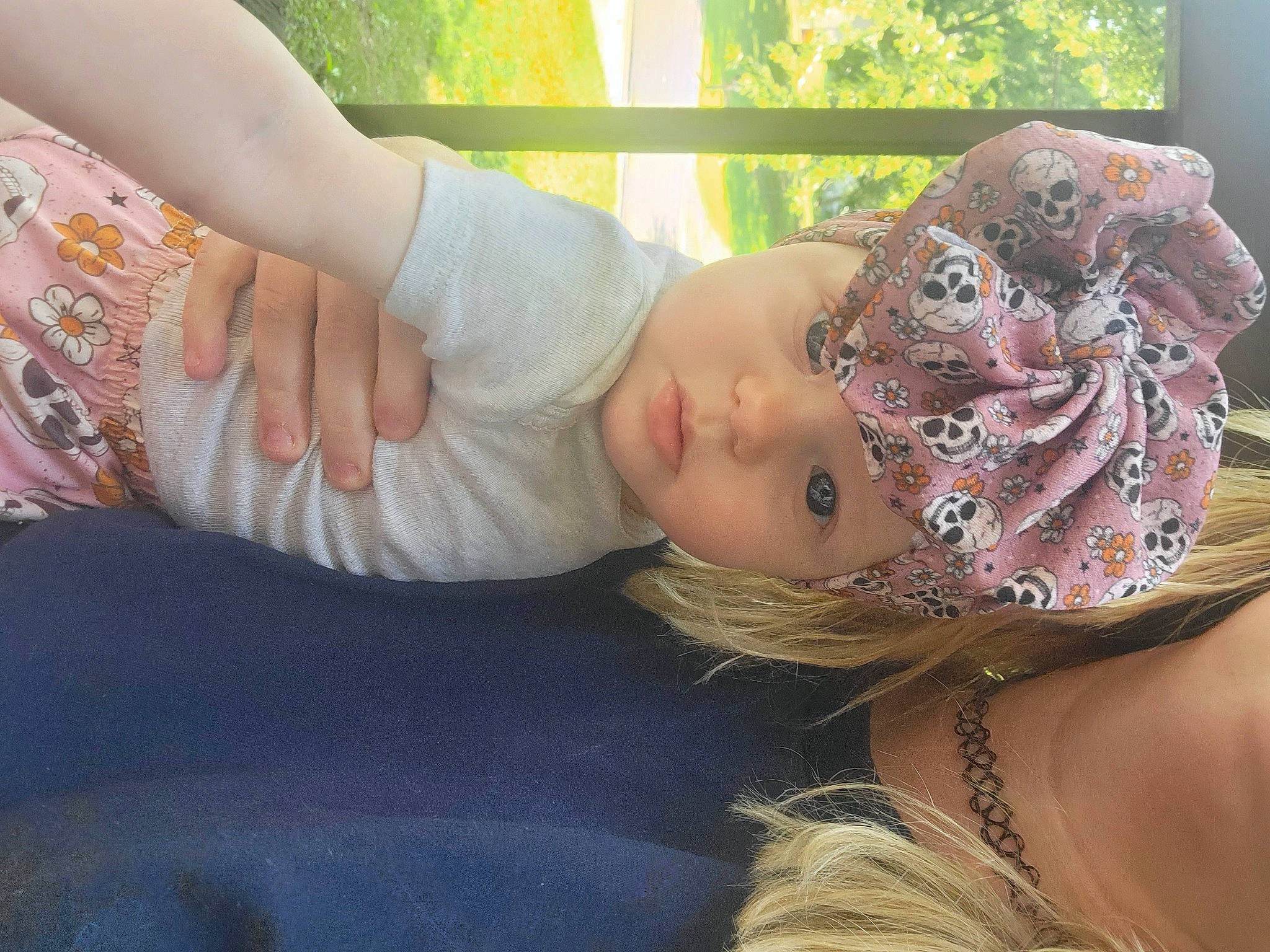 Esmae is registered to the contest to win money with this photo: baby, child, eye, eyelash, fashion_accessory, fun, gesture, grass, happy, hat, head, headpiece, headwear, jewellery, mouth, nail, pattern, person, plant, skin