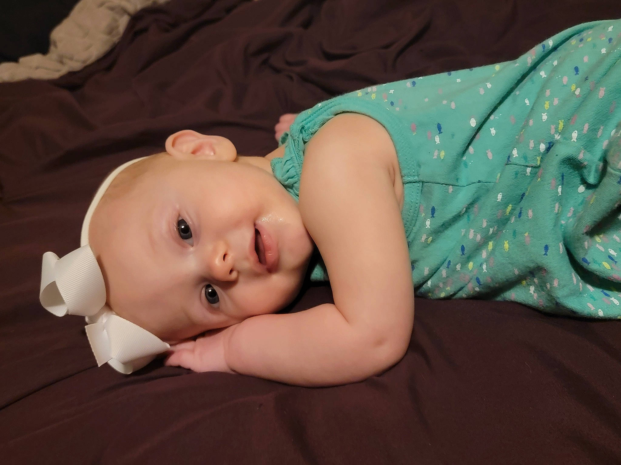 Esmae joined the competition — help win amazing prizes! baby, baby_products, baby_toddler_clothing, cheek, child, comfort, fashion_accessory, finger, flash_photography, flooring, fun, grass, headgear, linens, pattern, person, room, sitting, skin, toddler