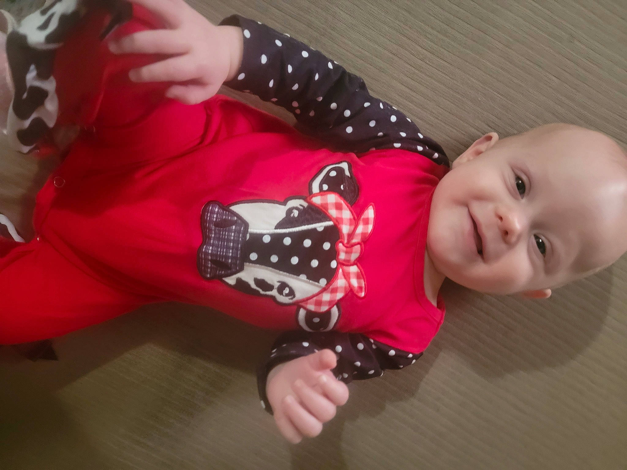 Esmae joined the competition — help win amazing prizes! arm, baby, baby_products, baby_toddler_clothing, carmine, child, elbow, fashion_accessory, finger, flooring, hand, happy, joy, nail, pattern, person, sitting, sleeve, smile, thigh