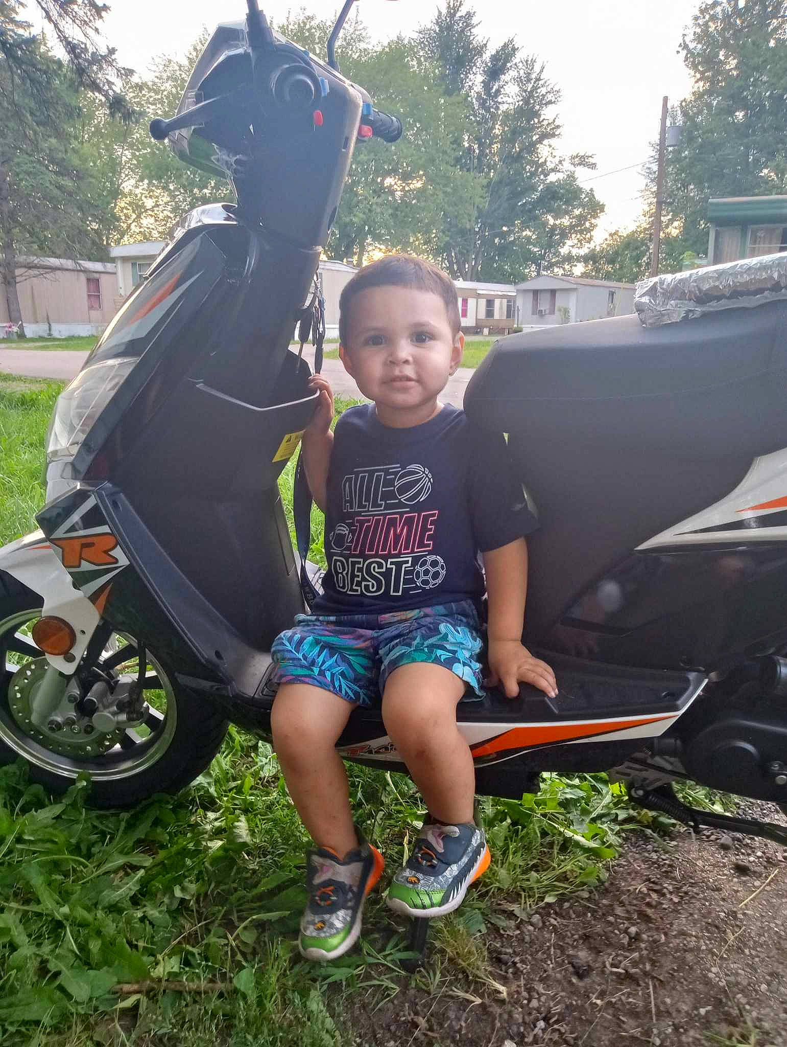 Javier joined the competition — help win amazing prizes! automotive_tire, child, cool, grass, leisure, mammal, motor_vehicle, outdoor_recreation, person, plant, recreation, shoe, shorts, sneakers, t_shirt, tire, toddler, tree, vertebrate, wheel