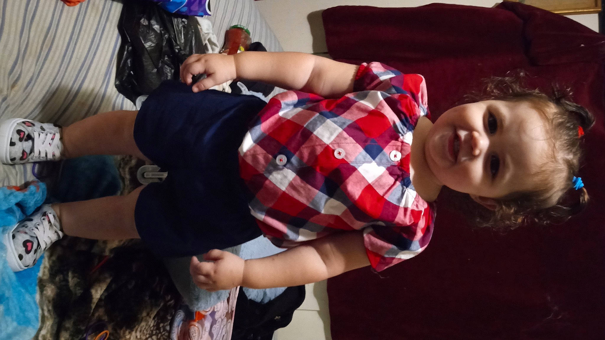 Chevelle is registered to the contest to win money with this photo: child, comfort, elbow, fashion, fun, hand, happy, human_leg, joy, pattern, person, plaid, room, sitting, sleeve, smile, tartan, textile, thigh, toddler