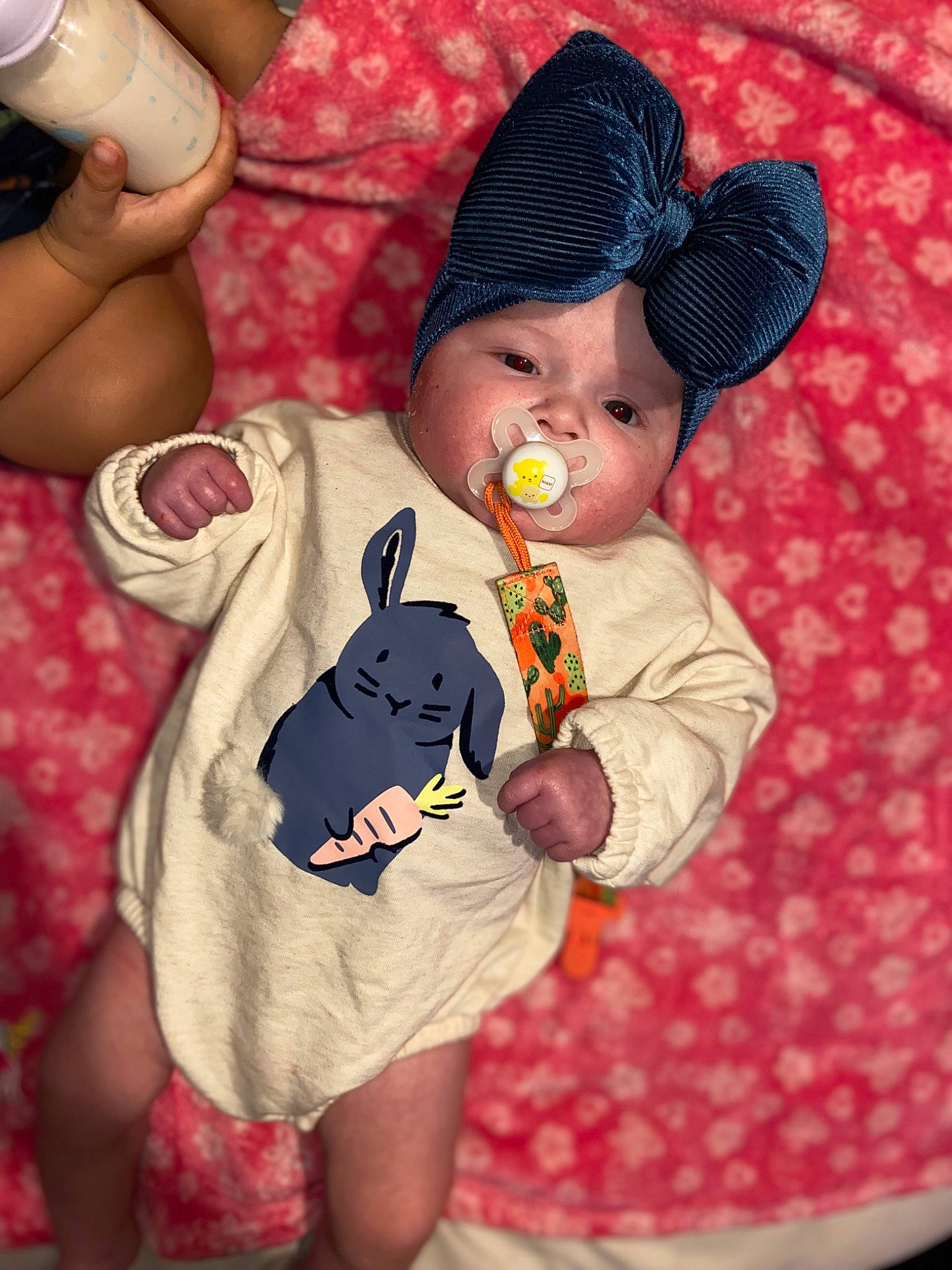 Lilliana is registered to the contest to win money with this photo: baby, baby_products, baby_toddler_clothing, cap, child, comfort, fedora, fun, hand, happy, hat, headwear, human_leg, pattern, person, pink, red, skin, sleeve, sun_hat